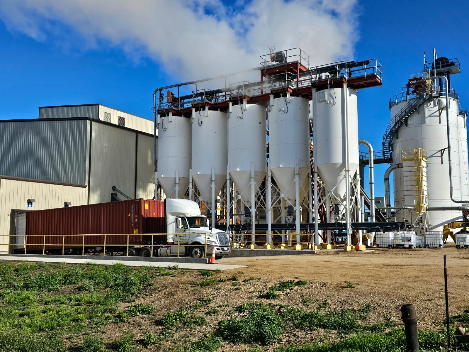 Arevalo truck delivering a container to a customer plant